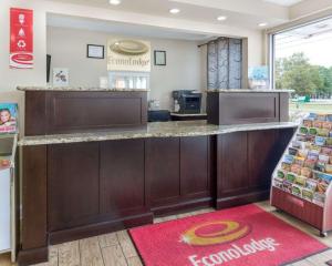 a large counter in a dental shop with a red carpet at Econo Lodge Town Center in Virginia Beach