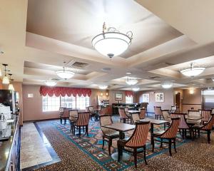 a large dining room with tables and chairs at Comfort Suites Dulles Airport in Chantilly