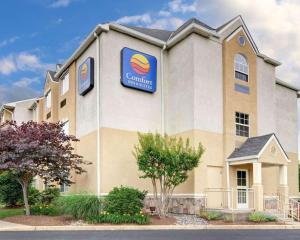 
a large building with a sign on the front of it at Comfort Inn & Suites Airport Dulles-Gateway in Sterling

