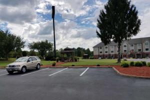 a car parked in a parking lot in front of a building at Quality Inn in Culpeper