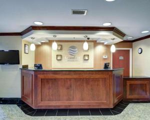 
a large room with a large counter and a large window at Comfort Inn & Suites Airport Dulles-Gateway in Sterling
