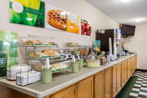 a buffet line with bread and pastries on it at Quality Inn in Culpeper