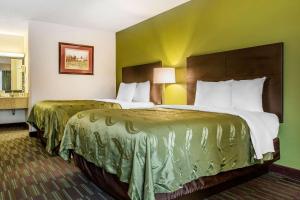 A bed or beds in a room at Quality Inn Culpeper