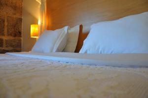 Giường trong phòng chung tại Hotel Rural de Charme Maria da Fonte