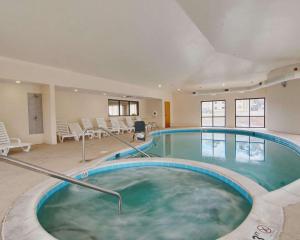 a large indoor swimming pool in a building at Comfort Suites Salem-Roanoke I-81 in Salem