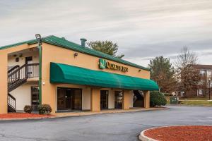 a southwest inn building with a green awning at Quality Inn in Culpeper