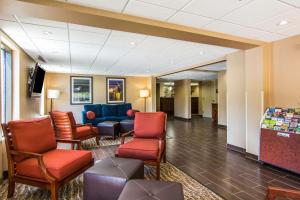 a waiting room in a hospital with chairs and tables at Comfort Inn Newport News-Williamsburg East in Newport News
