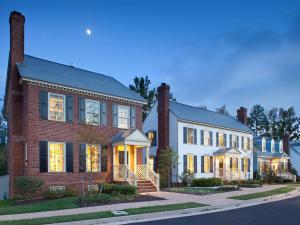 a large brick house with lights on at Bluegreen Parkside Williamsburg, Ascend Resort Collection in Williamsburg