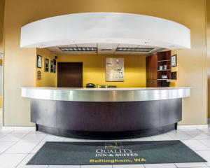 a lobby with a counter in a building at Quality Inn Grand Suites Bellingham in Bellingham
