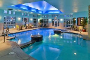 a large swimming pool in a hotel room at Comfort Suites Airport Tukwila Seattle in Tukwila