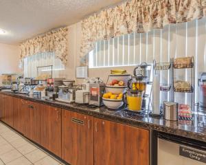 a kitchen with a counter with some food on it at Comfort Inn On the Bay in Port Orchard