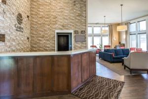 a lobby with a bar and a living room at Comfort Inn & Suites in Spokane Valley