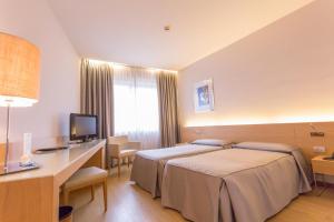 Postel nebo postele na pokoji v ubytování Hotel Internazionale + 37 fotografií