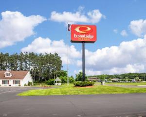 a sign for a candy store on the side of a road at Econo Lodge Inn & Suites Eau Claire in Eau Claire