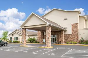 a parking lot in front of a building at Sleep Inn & Suites Conference Center Eau Claire North in Union