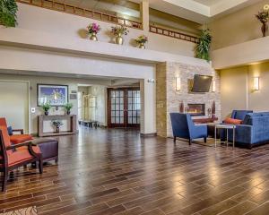 a lobby of a hotel with couches and a fireplace at Comfort Inn & Suites Grafton-Cedarburg in Grafton