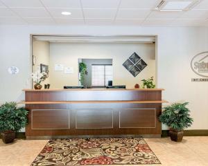 a waiting room with a reception desk in a hospital at Suburban Studios Morgantown in Morgantown