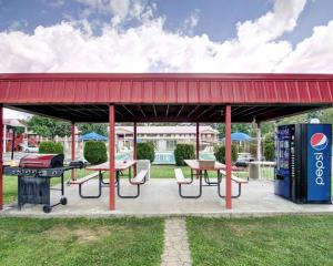 a gas station with picnic tables and a grill at Quality Inn New River Gorge in Fayetteville