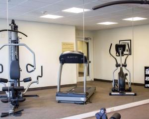 a gym with three exercise bikes in a room at Sleep Inn & Suites Moundsville in Moundsville