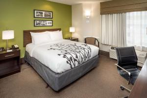 A bed or beds in a room at Sleep Inn