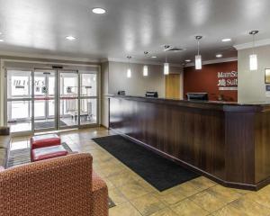 a lobby with a reception desk and a waiting room at MainStay Suites Casper in Casper