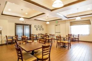 a dining room with wooden tables and chairs at Sleep Inn & Suites in Douglas