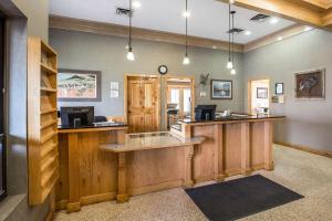 a bar in a lodge with wooden counter tops at Quality Inn Rock Springs in Rock Springs