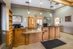 a bar in a lodge with wooden counter tops at Quality Inn in Rock Springs