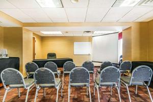 a conference room with chairs and a whiteboard at Quality Inn & Suites Lawrenceburg in Lawrenceburg