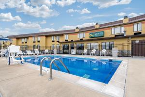 a pool in front of a hotel at Quality Inn & Suites Brownsburg - Indianapolis West in Brownsburg