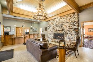 a living room with a stone fireplace and a couch at Quality Inn in Rock Springs