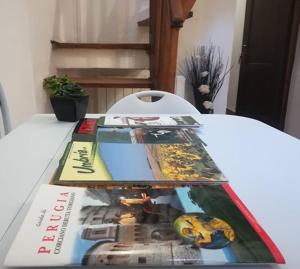 a book sitting on top of a table at Appartamento via del Grillo 8 in Perugia