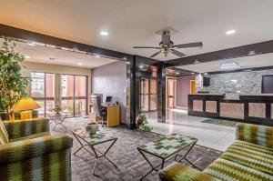 a lobby with couches and chairs and a table at Quality Inn South in Wichita