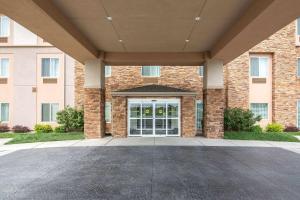 a building with a large glass door in front at Sleep Inn & Suites Haysville in Haysville