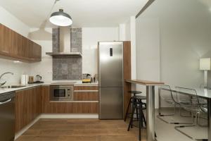 Kuchyňa alebo kuchynka v ubytovaní Apartamento Turístico Centro Monumental -- Caceres