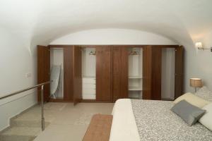 Posteľ alebo postele v izbe v ubytovaní Apartamento Turístico Centro Monumental -- Caceres