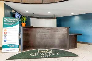 a podium in a lobby with a company sign on it at Quality Inn Lexington East-Hamburg Area in Lexington