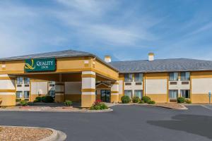 a hotel with a sign that reads outpost inn at Quality Inn Lewisport in Lewisport