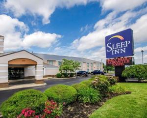 a sleep inn sign in front of a building at Sleep Inn Louisville Airport & Expo in Louisville