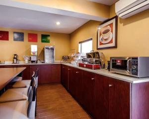 a kitchen with a counter top with a microwave at Comfort Suites Louisville East in Douglass Hills