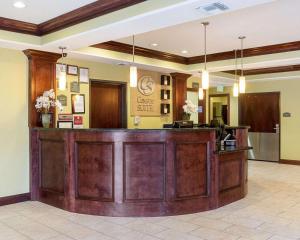 a lobby of a dental office with a reception desk at Comfort Suites Harvey - New Orleans West in Harvey