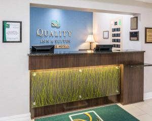a dental office with a reception desk with a fish tank at Quality Inn & Suites in West Monroe