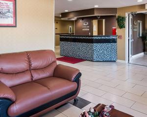 a leather couch in a waiting room with a lobby at Econo Lodge Inn & Suites Natchitoches in Natchitoches