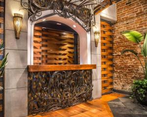a wine rack in a wall with an iron gate at Bluegreen Vacations Club La Pension in New Orleans