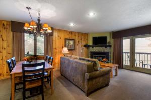 a living room with a table and a couch and a dining room at Bluegreen Vacations Blue Ridge Village, an Ascend Resort in Banner Elk