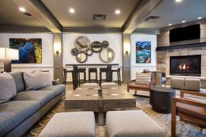 a living room with a couch and a fireplace at The Inn at Riverwalk in Edwards