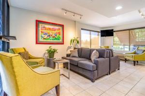 a living room with a couch and chairs at Quality Inn & Suites Creedmor - Butner in Creedmoor