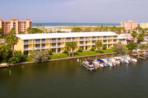a hotel with boats docked in a marina at Treasure Island Hotel and Marina in St Pete Beach