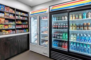 a refrigerator filled with lots of different types of drinks at Comfort Suites Grove City - Columbus South in Grove City