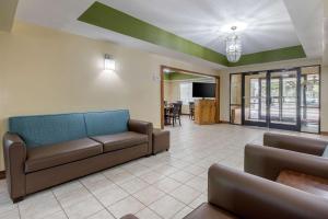 a living room with a couch and a dining room at Quality Inn in Kingstree